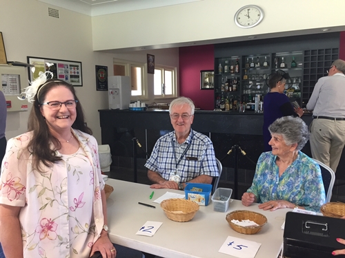 Melb Cup EL - Jenny Barnes picks up her sweep tickets from Malcolm Martin & June Straw